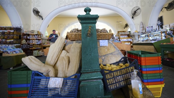 Colourful market with food baskets and fans in a vaulted room, water point, market hall, Agora, Kos