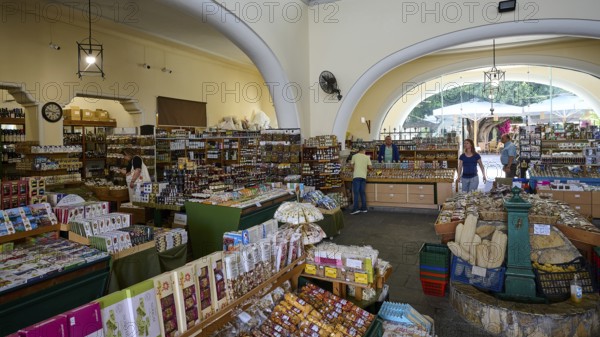 Interior view of a market with abundant produce and large arched windows, Market Hall, Agora, Kos