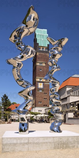 Stainless steel sculpture entitled Points of View by Tony Cragg in front of the Wedding Tower,