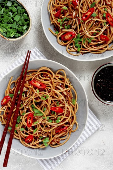 Udon noodles, with shimeji mushrooms, vegetables, in sauce, with sesame seeds, green onions, Asian