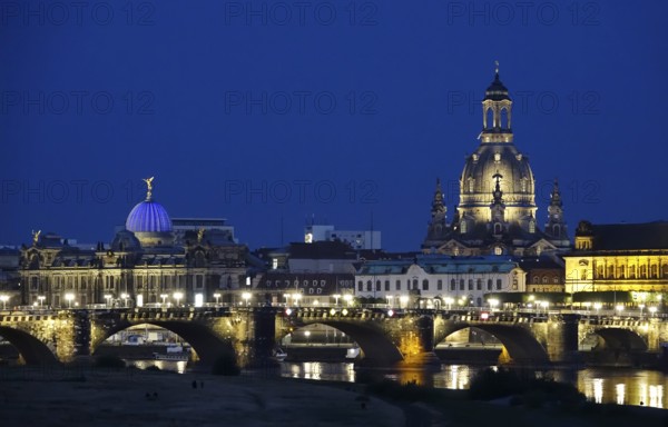 Dresden at the blue hour, view of the Church of Our Lady, art academy and Augustus Bridge, June,