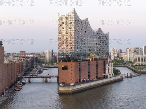 The Elbphilharmonie concert hall in Hamburg is reflected in the glass design above the historic