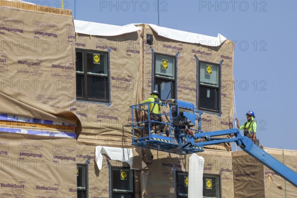 Detroit, Michigan - Workers use modular construction methods to build apartments for low to