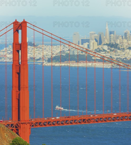 View of Golden Gate Bridge and financial district in the distance, San Francisco, California, USA
