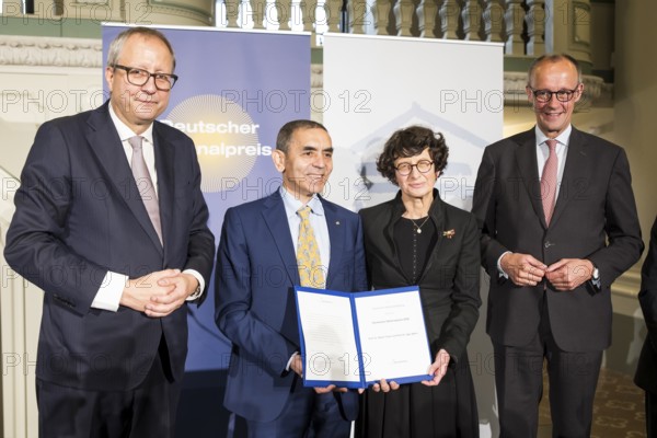 Thomas Mirow (Chairman of the Board of the German National Foundation), Ugur Sahin and Özlem Türeci