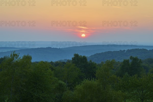 Pink sunset over wooded hills, quiet evening atmosphere, Geishöhe, Dammbach, Spessart, Bavaria,