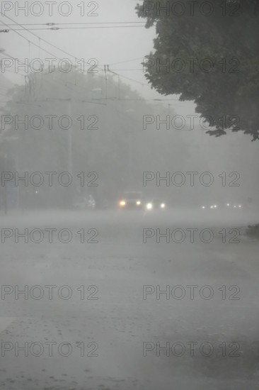 Driving a car in rainy weather, view through the windscreen, Germany