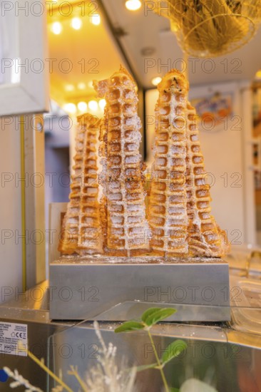 Fresh waffles with icing sugar at a market stall, Calw railway station festival, Black Forest,