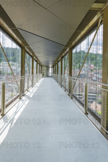 Interior view of a modern bridge with glass walls and panoramic views of the surrounding area, Zob