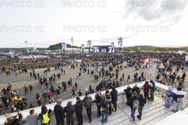 Festival-goers look at the Mandora Stage in the evening sun at the Rock am Ring Festival on Sunday,