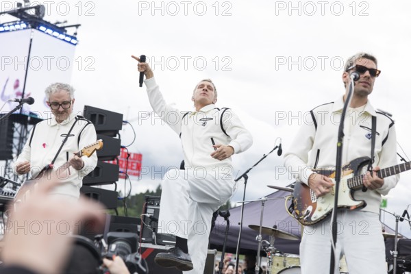 Steffen Israel (guitarist and keyboarder), Felix Brummer (singer) and Karl Schumann (guitarist) of