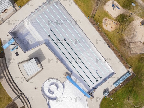 Aerial view of an empty swimming pool with clearly marked swimming lanes, renewal of the swimming