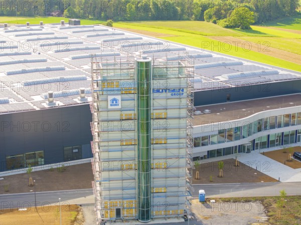 Industrial building with green surroundings and scaffolding, equipped with solar system, ING Park