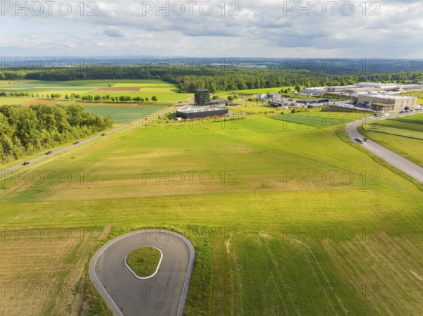 Wide green fields with a country road and surrounding rural landscape, ING Park development area,