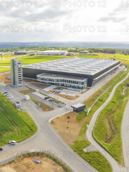 Bird's eye view of large industrial building with surrounding fields and roads, ING Park