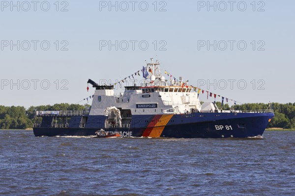 Decorated ship of the German Coast Guard and Federal Police BP 81 Potsdam leaves the Port of