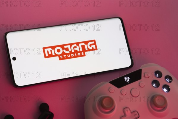 Dhaka, Bangladesh- 08 Apr 2025: A smartphone displaying the Mojang Studios logo next to a gaming