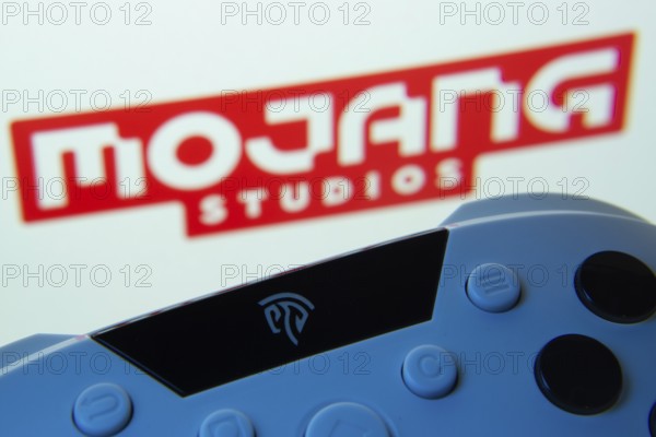 Dhaka, Bangladesh- 24 Mar 2025: A close-up of a gamepad with the Mojang Studios seen on screen in