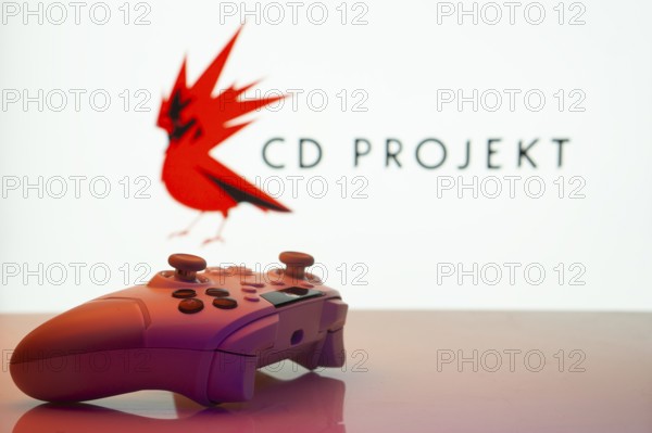 Dhaka, Bangladesh- 20 Mar 2025: A close-up of a white gamepad with the CD Projekt seen on screen in