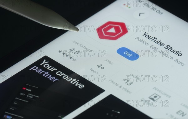 Dhaka, Bangladesh- 30 Oct 2025: Youtube Studio app on a iPad screen with a pen pointing at the