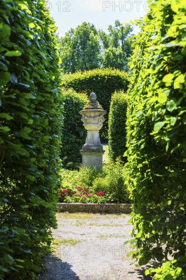 Visual axis through arcades to an ornamental sandstone vase, Pulsnitz Castle Park, Saxony, Germany
