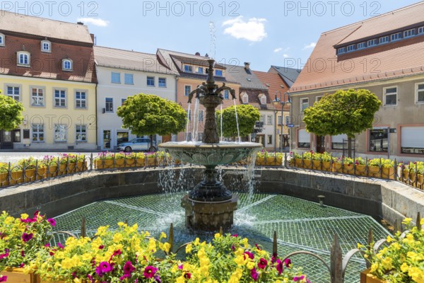 Sandstone market fountain on the medieval market square, in the background the monument to the