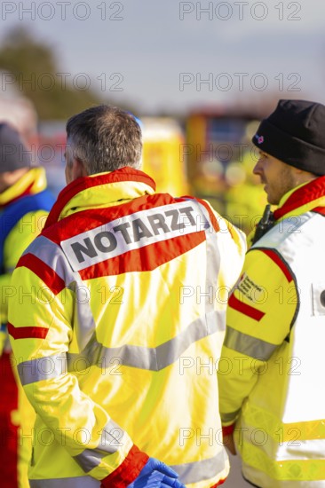 Rescue team wearing operational clothing in an emergency situation on a road, fire brigade exercise