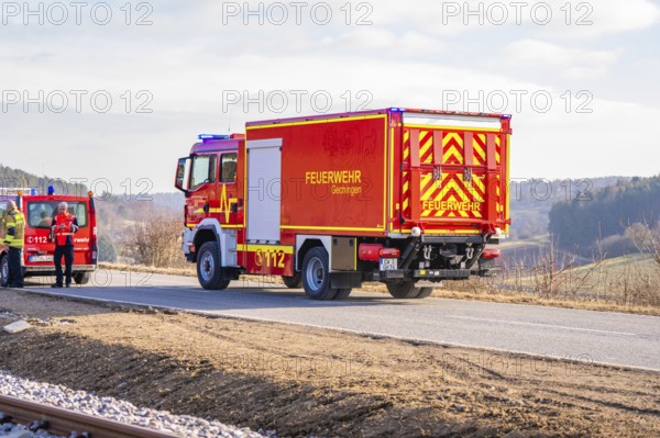 Red fire engine on a rural road in clear winter skies, fire department exercise on the Hermann