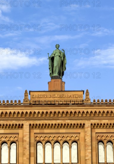 Facade of the government of Upper Bavaria building in Maximilian style with figure,