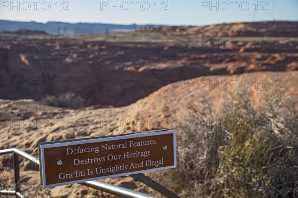Page, Arizona - A sign at a viewpoint for the Glen Canyon Dam asks visitors to refrain from placing