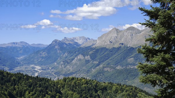 Extensive mountain range in sunny weather with lush forest and clear sky, Peaks of the Balkans,