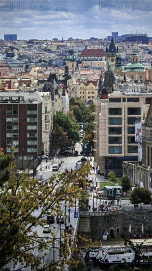 Urban view of buildings, roads and trees in a lively city, Prague, Czech Republic