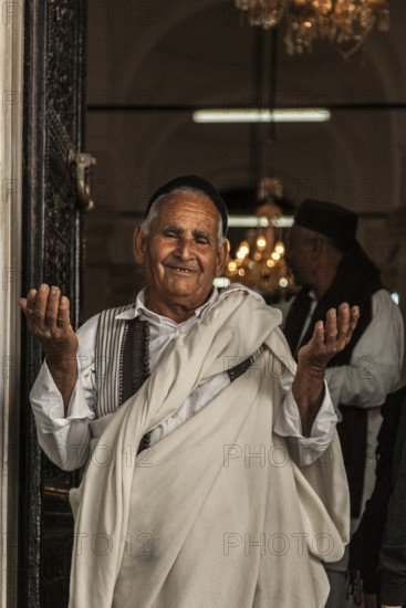 Tripoli, Libya, North Africa. An elderly Libyan man at the door of a Mosque