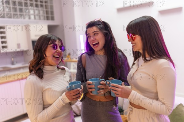 Three smiling young women friends wearing stylish sunglasses and casual clothes sharing a happy