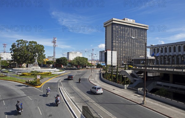 Street scene in zone 14, on the left the Peace Memorial or Monumento a la Paz, Guatemala City,