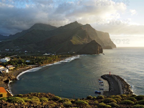 Coastal region with port and lighthouse, surrounded by mountains and sea, Puerto de la Aldea, Gran