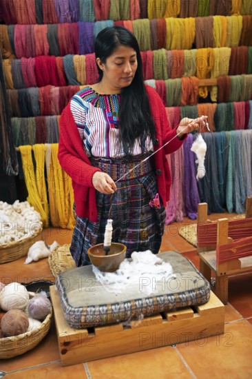 Maya woman, 42 years old, spinning cotton, traditional craft in a woman's cooperative, San Juan la