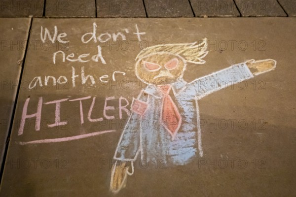 Phoenix, Arizona - Messages written in chalk on the sidewalk at the Arizona State Capitol during a