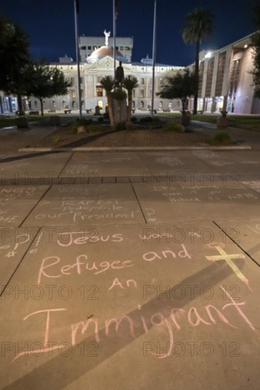 Phoenix, Arizona - Messages written in chalk on the sidewalk at the Arizona State Capitol during a