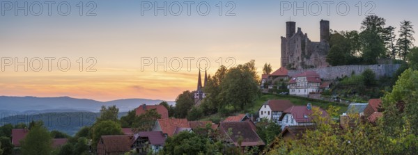 View of the ruins of Hanstein Castle and the small village of Rimbach with village church with