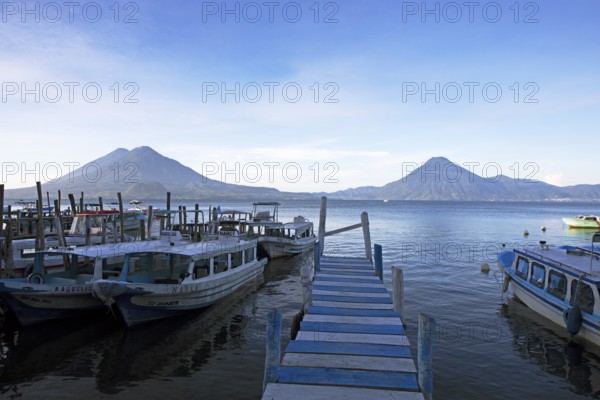 Boats on the pier, Lake Atitlán or Lake Atitlán in the morning, the volcanoes San Pedro, Atitlán