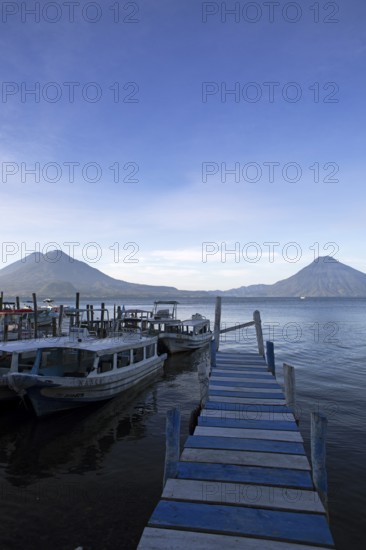 Boats on the pier, Lake Atitlán or Lake Atitlán in the morning, the volcanoes San Pedro, Atitlán