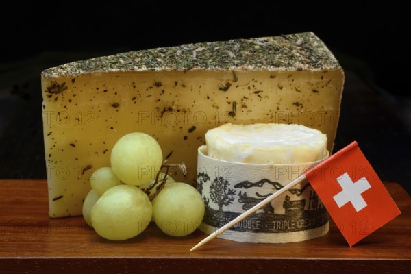 Plate of Swiss cheese, Gstaad mountain cheese with herbs and cream cheese 'Fette Berta',