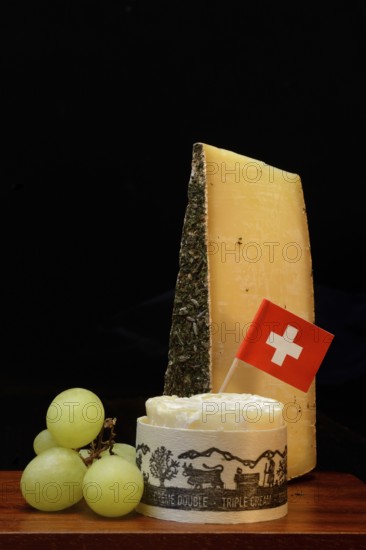 Plate of Swiss cheese, Gstaad mountain cheese with herbs and cream cheese 'Fette Berta',