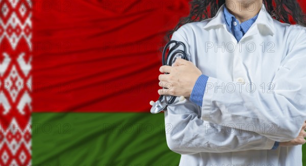 Healthcare professional with Belarus flag background. Professional doctor holding stethoscope on