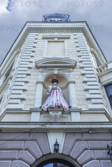 Mannequin in Ukrainian traditional costume in a niche at a 19th-century house, Czernowicz, Ukraine