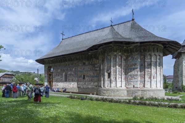 Tour group in front of Humor Monastery, Romanian Orthodox Women's Monastery, 1530, Gura Humorului,