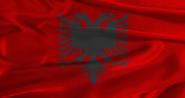 Flag of Albania with fabric textured background. Close up of National flag of Albania with