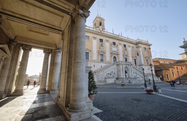 Arcade, columns of the Palazzo Nuovo in the morning light, Senators' Palace (Palazzo Senatorio) in