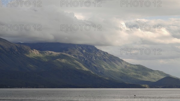 Landscape view of hills under a cloud cover, bordering a lake, Lake Ohrid, North Macedonia